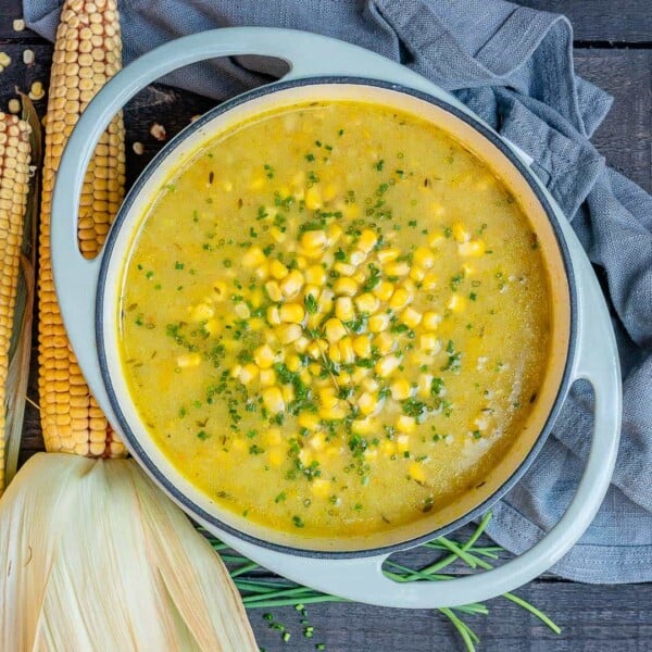 corn soup in a round white pot.