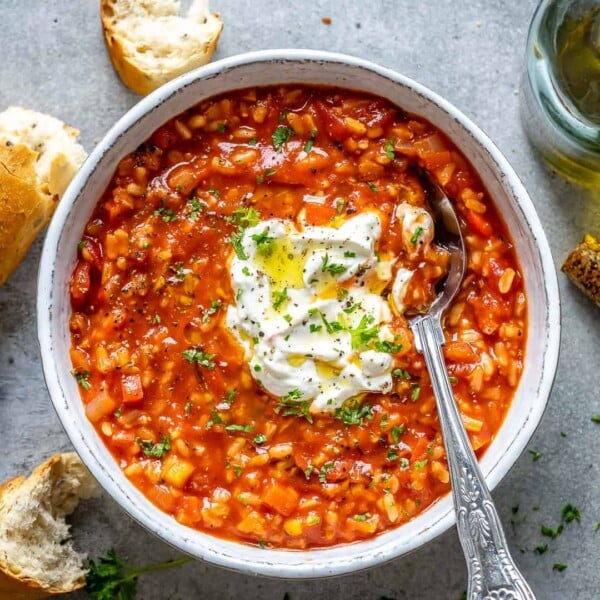top view tomato rice soup with spoon in it
