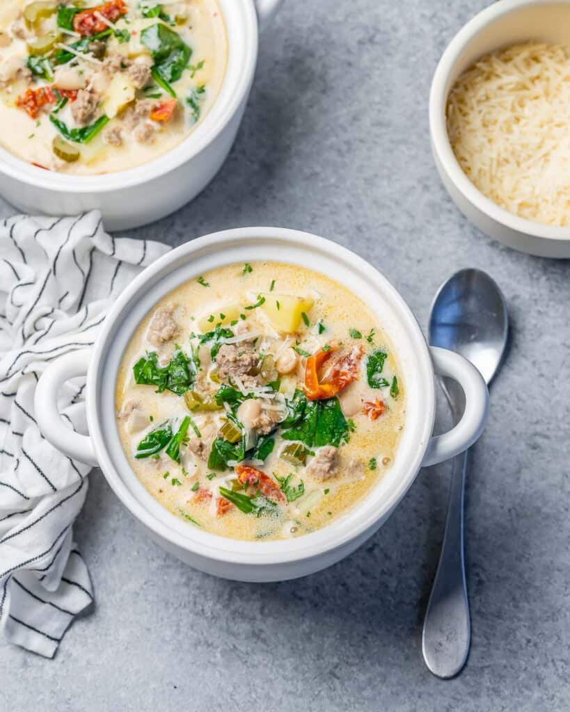 Top view of a small white bowl with Tuscan-style white bean soup.