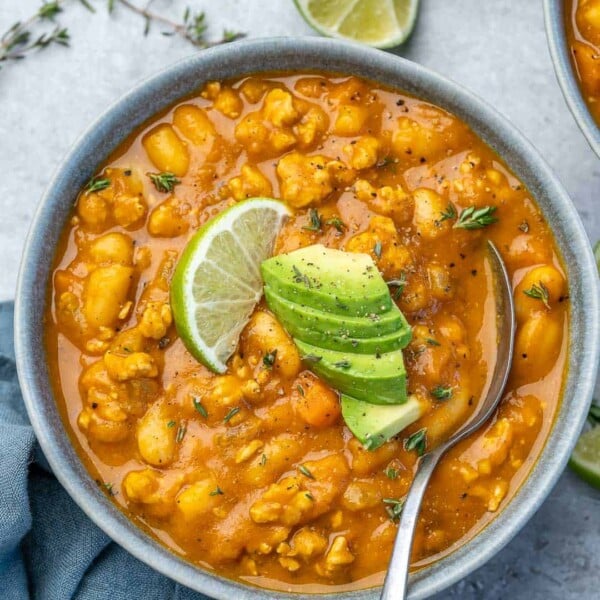 top view of a bowl pumpkin chili with spoon in it