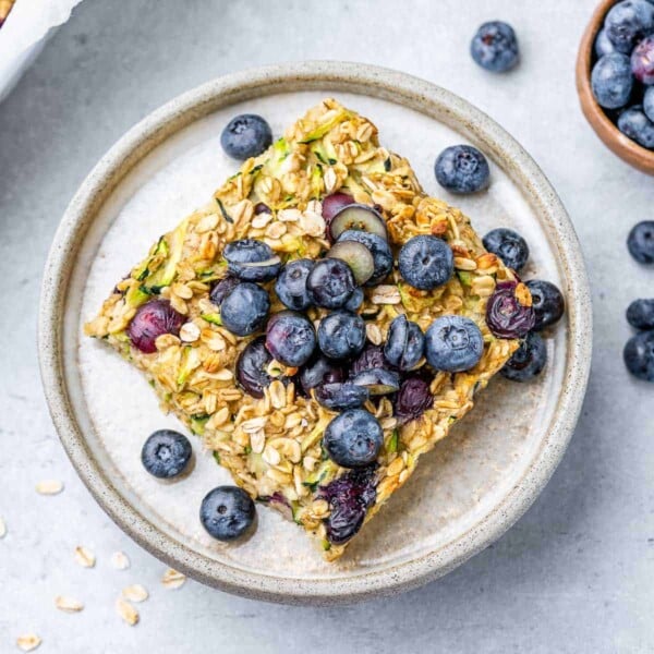 top view of a serving of baked oatmeal topped with blueberries
