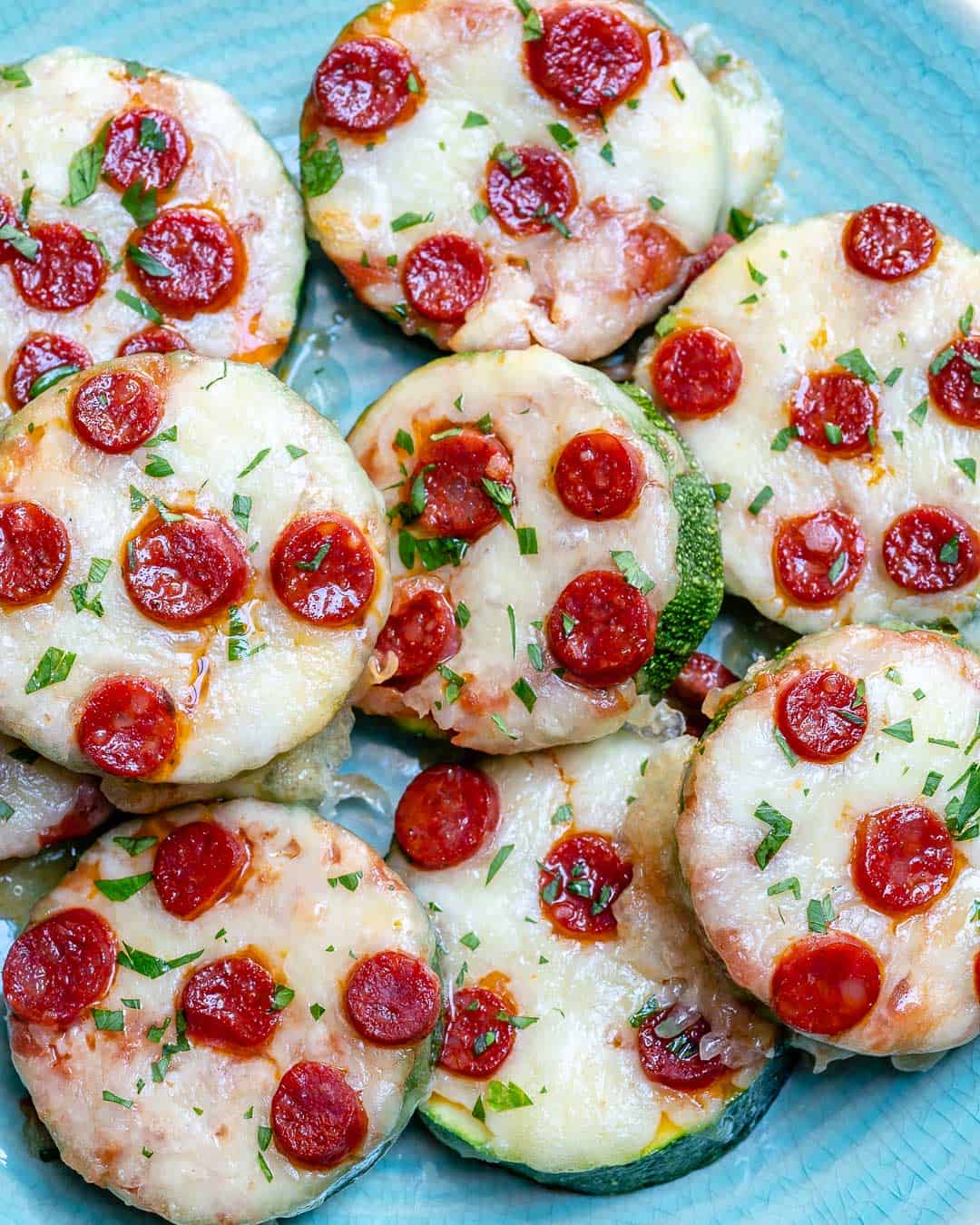 mini zucchini pizza bite slices on a plate.